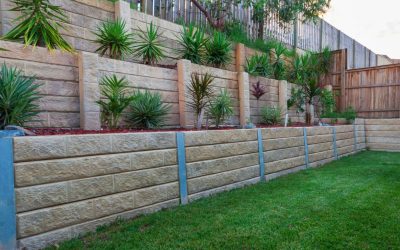 Retaining Walls 101: How They Prevent Erosion, Manage Runoff, and Protect Your Pavement Investment